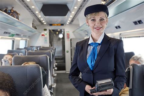 Portrait confident female attendant on train - Stock Image - F021/6223 - Science Photo Library