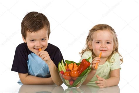 Happy kids eating vegetables Stock Photo by ©ilona75 6430128