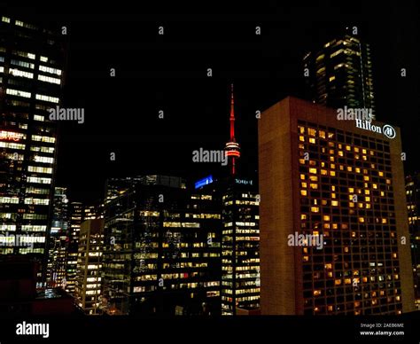 CN Tower and Hilton hotel at night in the city of Toronto, Ontario ...