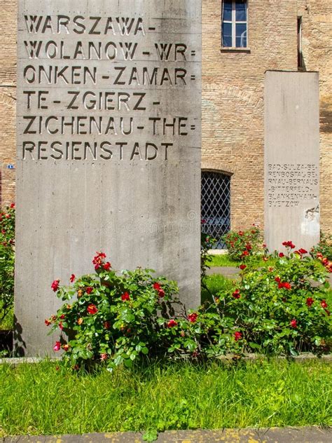 The Holocaust Memorial with Written Stele and Green Grass and Roses Editorial Photography ...