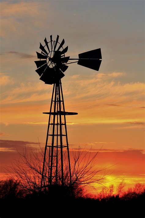 Kansas Golden Sunset with a Windmill Silhouette out in the country. | Windmill art, Windmill ...