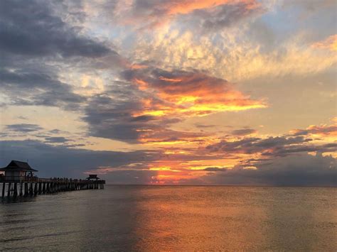 Yuval David • Sunset on the beach in Naples, Florida — one of...