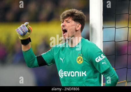 Borussia Dortmund goalkeeper Gregor Kobel saves a shot from Real Madrid ...