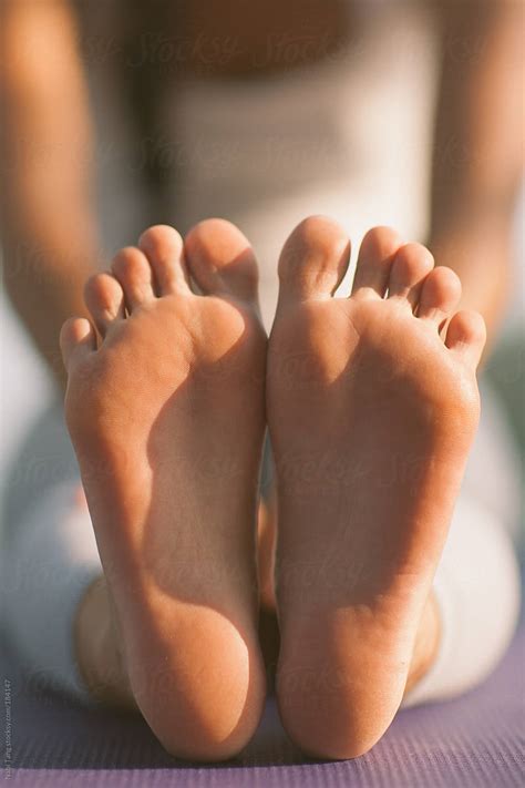 "Woman Doing Yoga - Closeup Of Her Bare Feet" by Stocksy Contributor "Nabi Tang" - Stocksy