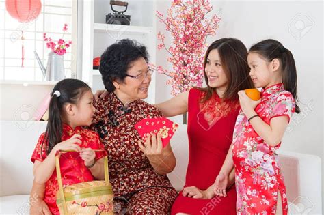 Happy multi generations Asian family celebrate Chinese new year at home. Chinese New Year Outfit ...