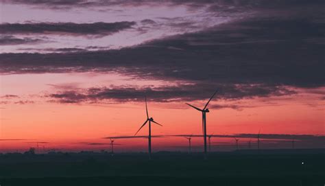 Wind Turbines Under Cloudy Sky during Sunset · Free Stock Photo