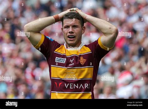 The Huddersfield Giants players stand stunned and dejected after losing ...