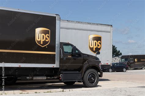 UPS delivery and transport trucks. UPS picks up, transports and delivers packages and parcels ...