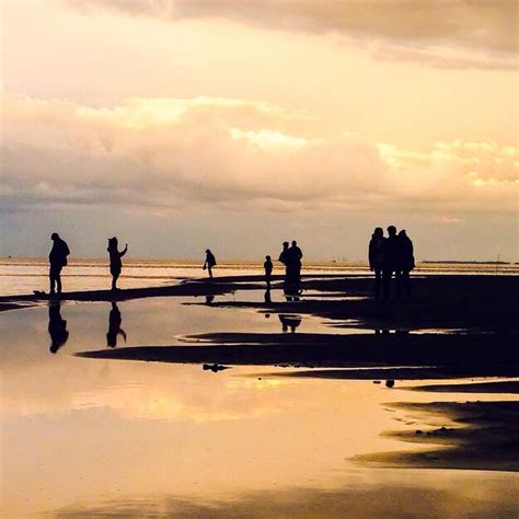 Premium Photo | Silhouette people walking on beach at dusk