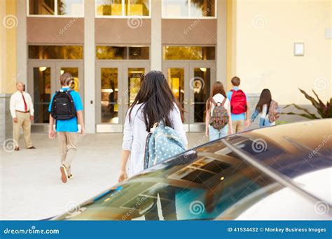 High School Students Being Dropped Off At School By Parents Stock Photo ...