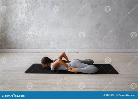 Woman Practicing Advanced Yoga. A Series Of Yoga Poses Stock Image | CartoonDealer.com #89493841