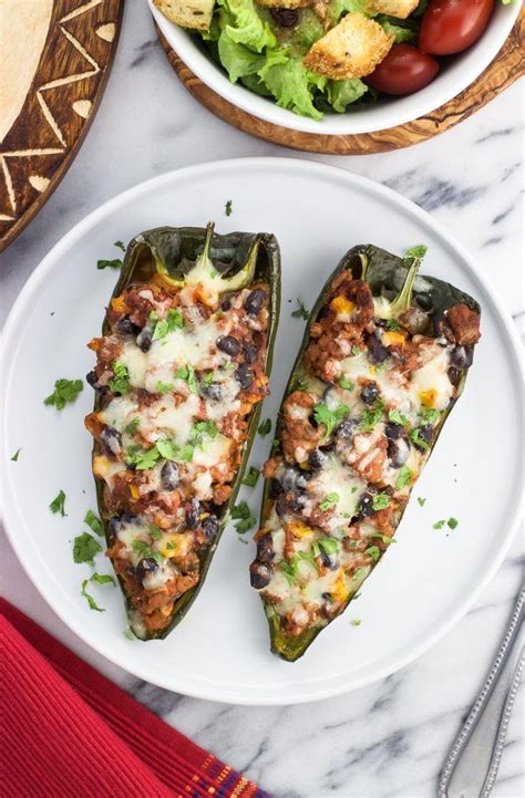 This healthy stuffed poblano peppers recipe is packed with turkey, black beans, and southwester ...