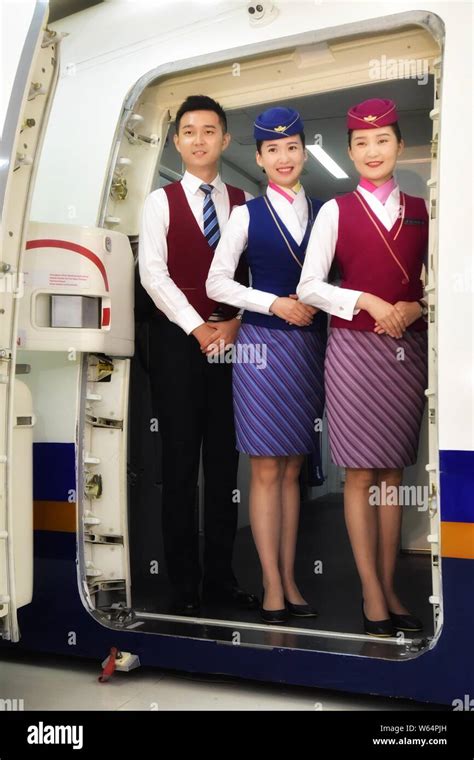 Flight attendants of China Southern Airlines present their uniforms ...