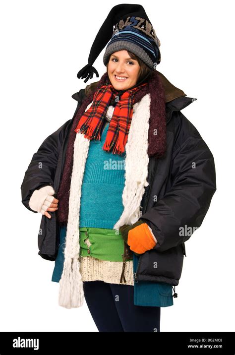 Happy young woman wearing multi-layers of clothing to keep warm Stock ...