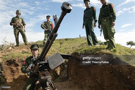 Officers and soldiers of the Kachin Independence Army check a Chinese ...