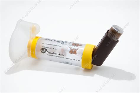 Asthma inhaler and spacer - Stock Image - C033/6271 - Science Photo Library