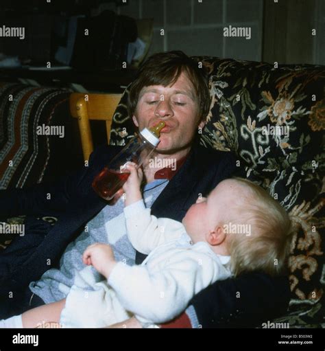 Alex Higgins May 1982 ex snooker player with his baby bottle Alex Higgins Stock Photo - Alamy