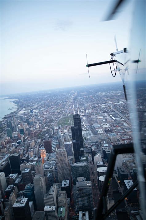 Drone Flying Over City Buildings · Free Stock Photo