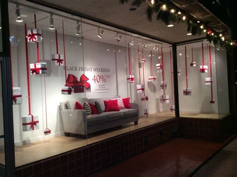 a store window with red and white christmas decorations