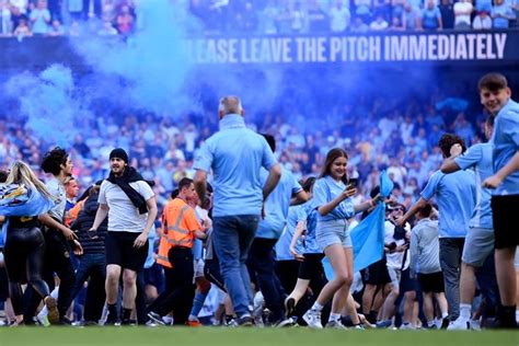 Man City fans invade the pitch after Chelsea win as rivals slam 'small ...