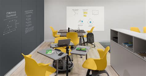 Collaborative classroom with adjustable workstations for students and ...