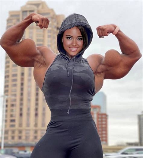 Woman Flexing Biceps - HooDoo Wallpaper