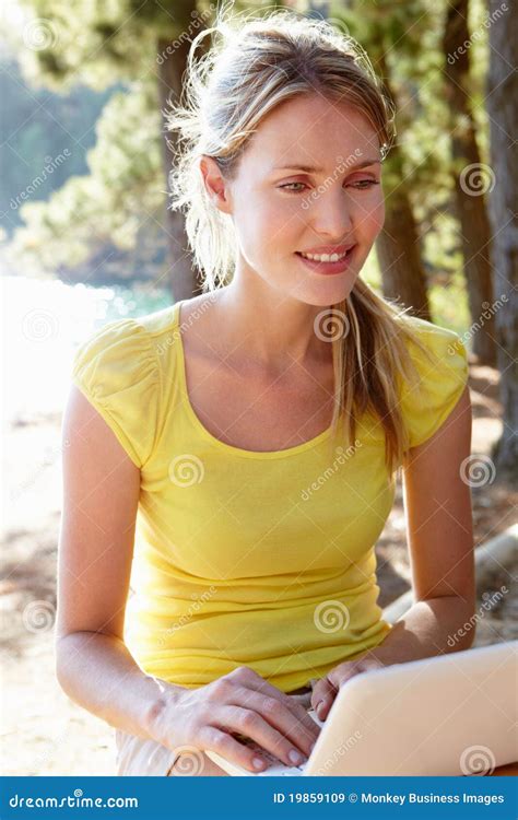 Young Woman with Laptop Smiling Stock Image - Image of nature, email: 19859109