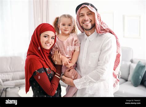 Happy Muslim family at home Stock Photo - Alamy