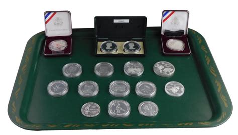 Lot - COINS: Sixteen Olympic commemorative coins, from the United ...