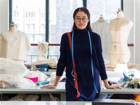 "Chinese Fashion Designer In Fashion Design Studio, Portrait." by Stocksy Contributor "Vuelyfe ...