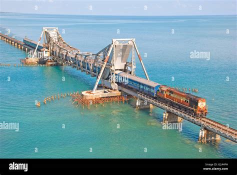 Diesel locomotive hauled passenger train over Pamban Sea Bridge, Rameshwaram, Tamil Nadu, India ...