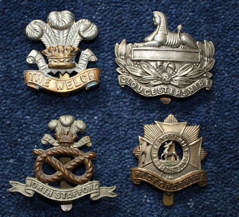 WW1 Four (4) British Army Regimental Cap Badges. in Helmet & cap badges