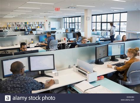 Business people working in open office Stock Photo: 77127053 - Alamy