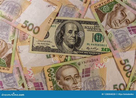 One Hundred Dollar Bill On Background Of Ukrainian Five Hundred Hryvnia Banknotes Stock Photo ...