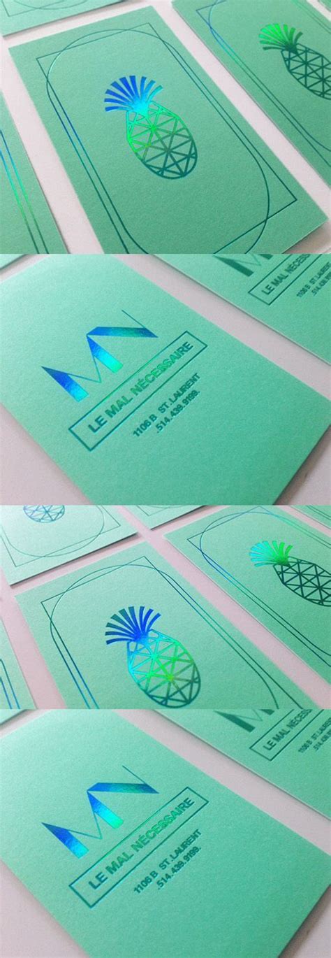 several green business cards sitting on top of each other