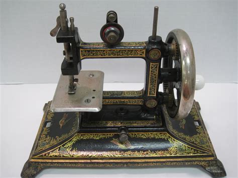 Antiques, Art, and Collectibles: Antique miniature sewing machine