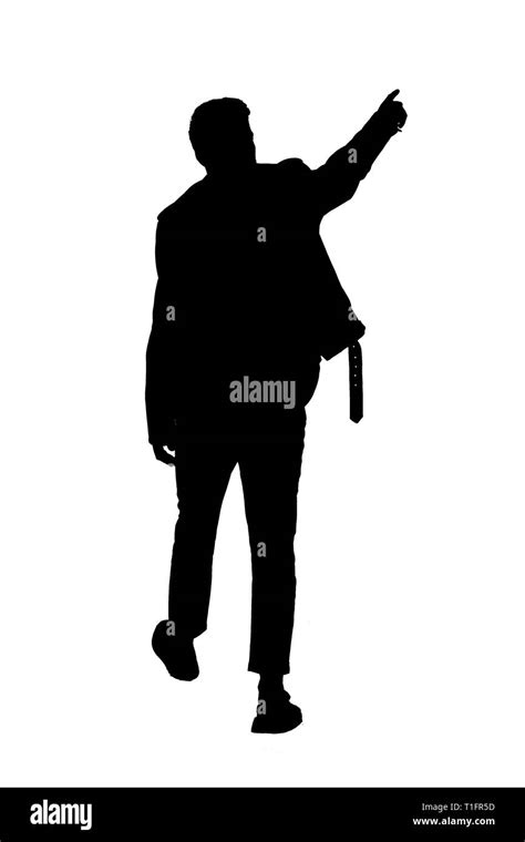 Back view black silhouette of a man walking with a pointing hand. going guy showing. backside ...