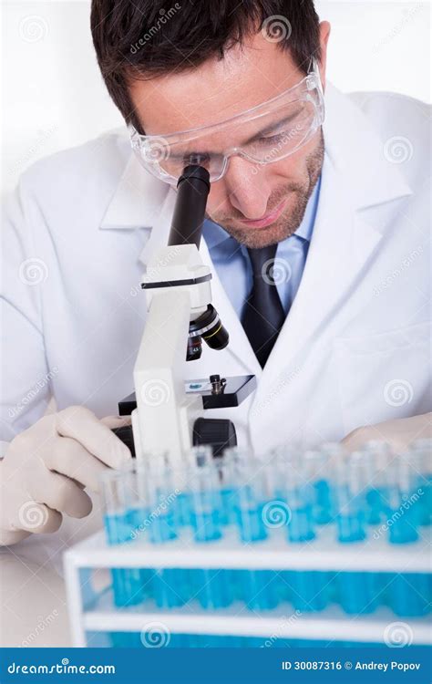 Pathologist Or Lab Technician Using A Microscope Royalty-Free Stock ...