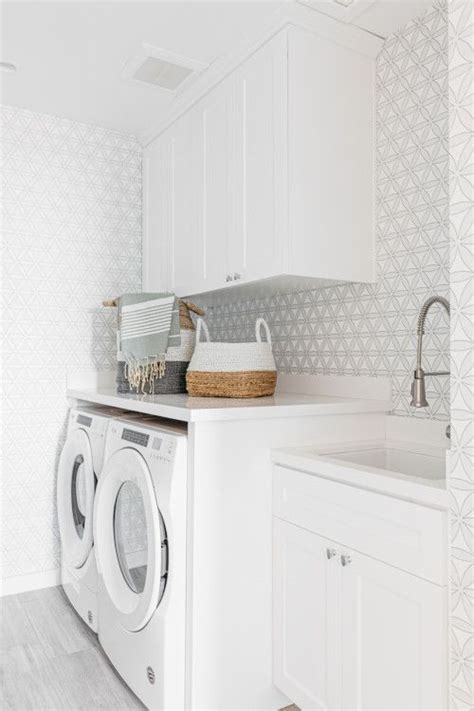 Bright and Organized White Laundry Room Cabinets