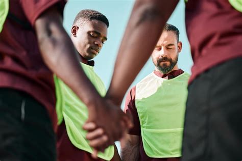 Premium Photo | Rugby holding hands and men with prayer game and training with competition ...