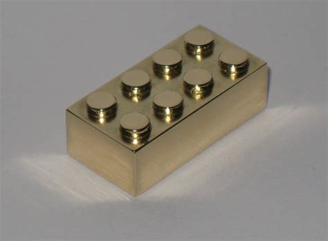 Ultra-rare solid gold Lego brick sells at auction for price of a large ...