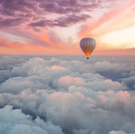 Hot air balloon flying above the clouds in a cotton candy colored sky | Hot air ballon, Balloons ...