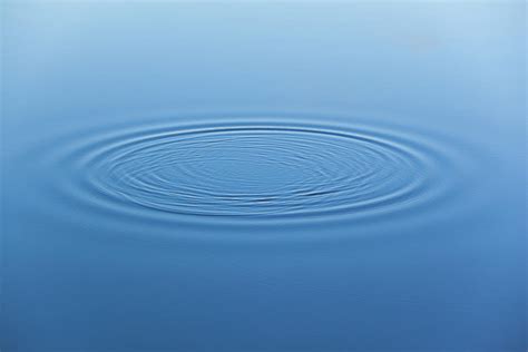 Water Ripples On The Surface Of Smooth Photograph by Alex Potemkin