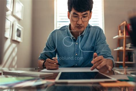 Architect working at his office desk – Jacob Lund Photography Store ...