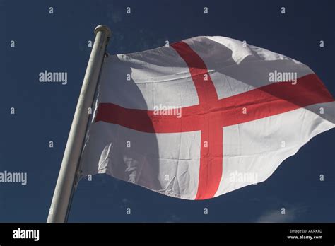 english flag blowing in the wind Stock Photo - Alamy