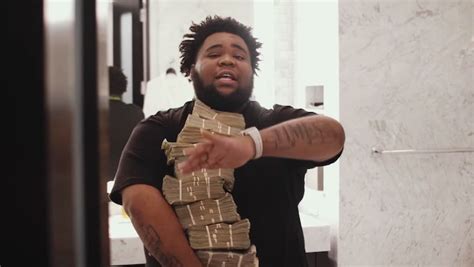 Rod Wave Hugs A Stack Of Money In His Boastful 'Freestyle' Video