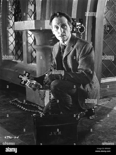 PETER CUSHING as Doctor Professor Abraham Van Helsing in THE BRIDES OF DRACULA 1960 director ...