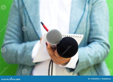 Female Journalist at News Conference, Writing Notes, Holding Microphone Stock Image - Image of ...