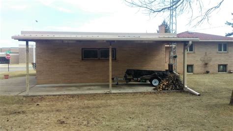 LeafGuard Gutters Installed onto Carport with tip-up downspout in ...