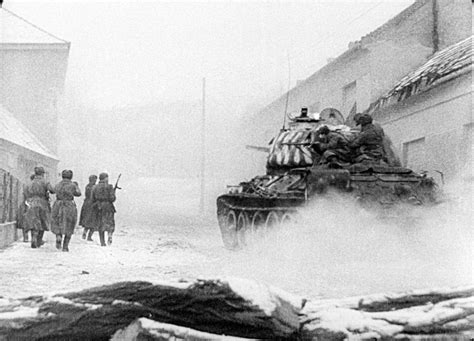 Red Army soldiers with the support of a T-34 tank on the streets of ...